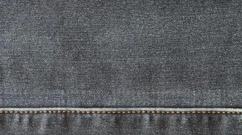 Texture of the surface of denim material Stock Photos