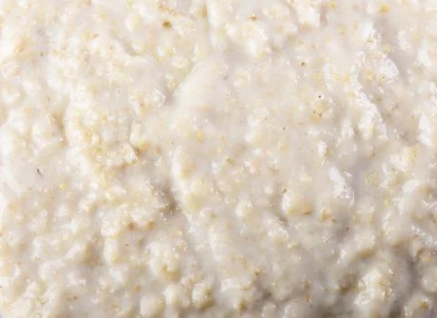 The texture of the surface of freshly cooked oatmeal. Stock Photos