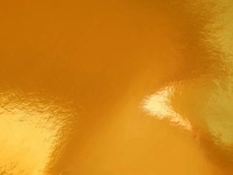 The texture of the surface of the golden background Stock Photos