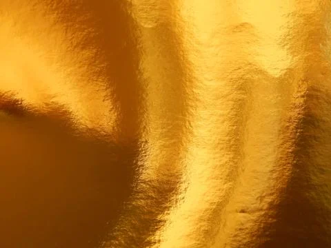 The texture of the surface of the golden background Stock Photos