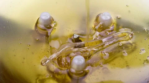 Texture of sweet stretching honey. Close-up and macro of honey bubbles. Stock Footage 102800895
