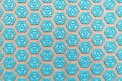 Texture from the therapeutic massage mat. Sharp hexagons. Stock Photos