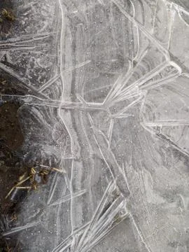 Texture of thin and broken ice closeup photo Stock Photos