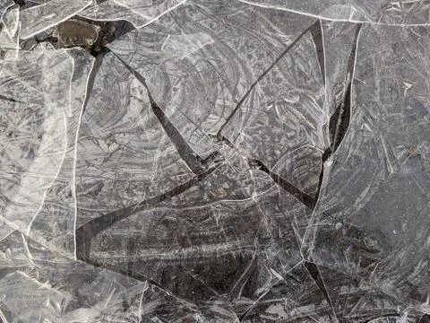 Texture of thin and broken ice closeup photo Stock Photos