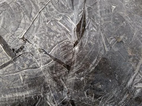 Texture of thin and broken ice closeup photo Stock Photos