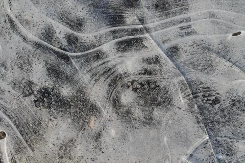 Texture, thin ice. The first thin crust of ice on a puddle transparent and de Stock Photos