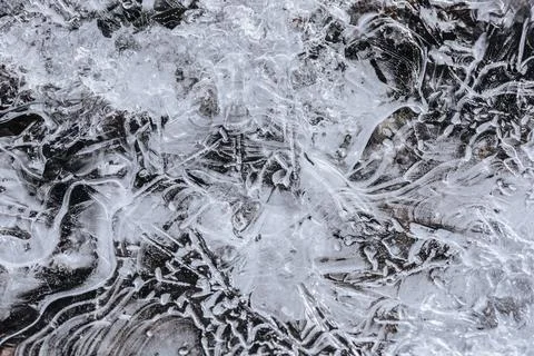 The texture of the thin ice on the water surface Stock Photos