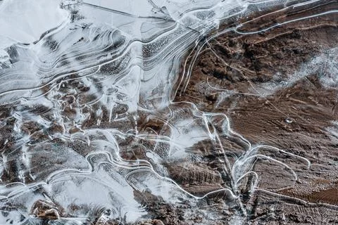 The texture of the thin ice on the water surface Stock Photos
