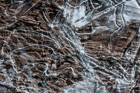 The texture of the thin ice on the water surface Stock Photos