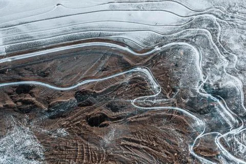 The texture of the thin ice on the water surface Stock Photos