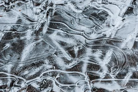 The texture of the thin ice on the water surface Stock Photos