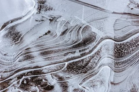 The texture of the thin ice on the water surface Stock Photos