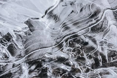 The texture of the thin ice on the water surface Stock Photos