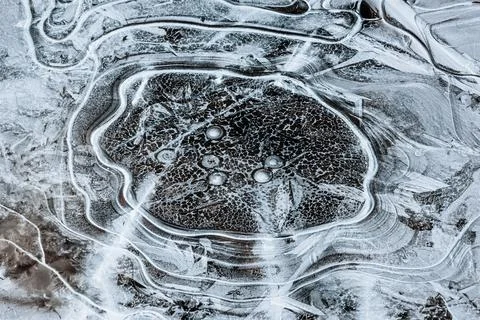 The texture of the thin ice on the water surface Stock Photos
