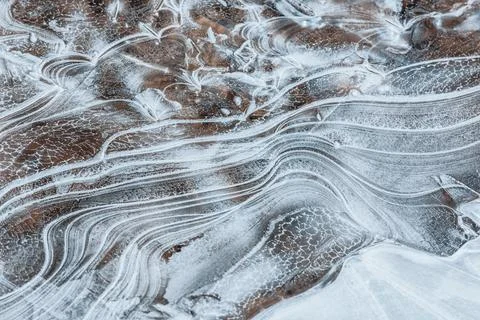 The texture of the thin ice on the water surface Stock Photos