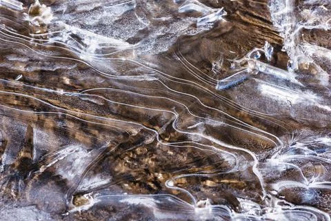 The texture of the thin ice on the water surface Stock Photos