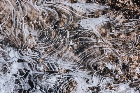 The texture of the thin ice on the water surface Stock Photos