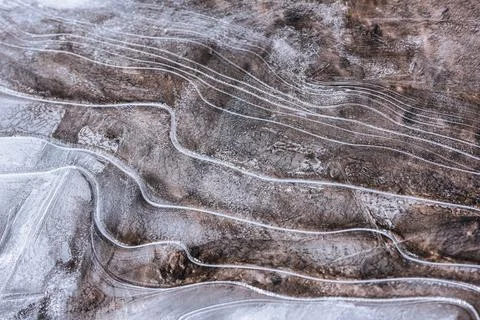 The texture of the thin ice on the water surface Stock Photos