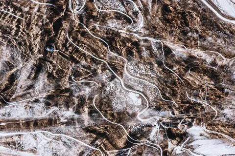 The texture of the thin ice on the water surface Stock Photos
