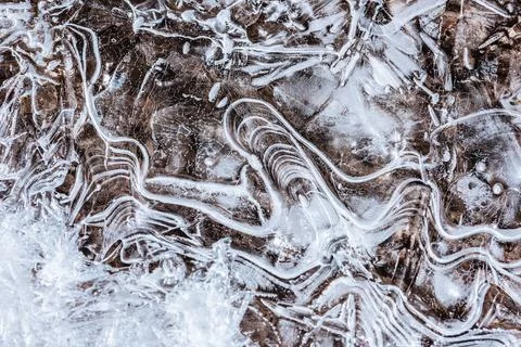 The texture of the thin ice on the water surface Stock Photos