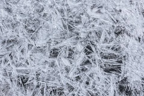 The texture of the thin ice on the water surface Stock Photos