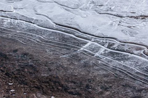 The texture of the thin ice on the water surface 스톡 사진