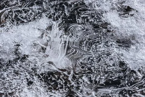 The texture of the thin ice on the water surface Stock Photos