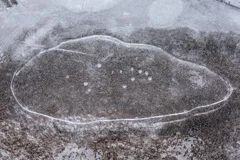 The texture of the thin ice on the water surface Stock Photos