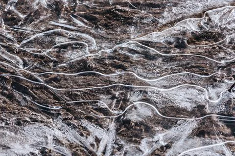 The texture of the thin ice on the water surface Stock Photos