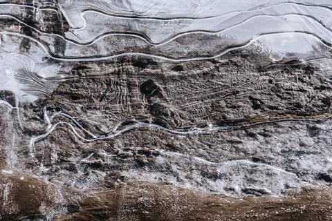 The texture of the thin ice on the water surface Stock Photos