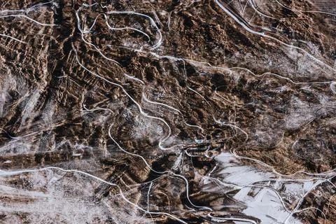 The texture of the thin ice on the water surface Stock Photos