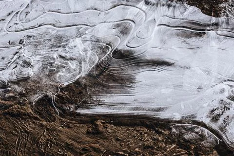 The texture of the thin ice on the water surface Stock Photos