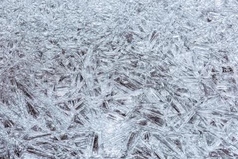 The texture of the thin ice on the water surface Stock Photos