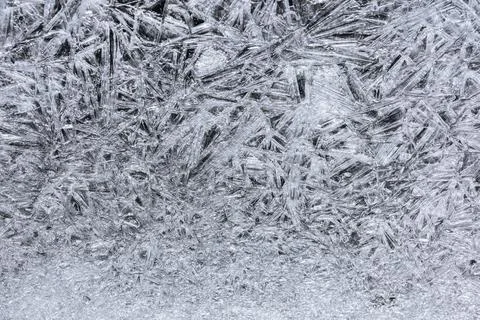 The texture of the thin ice on the water surface Stock Photos