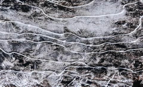 The texture of the thin ice on the water surface Stock Photos