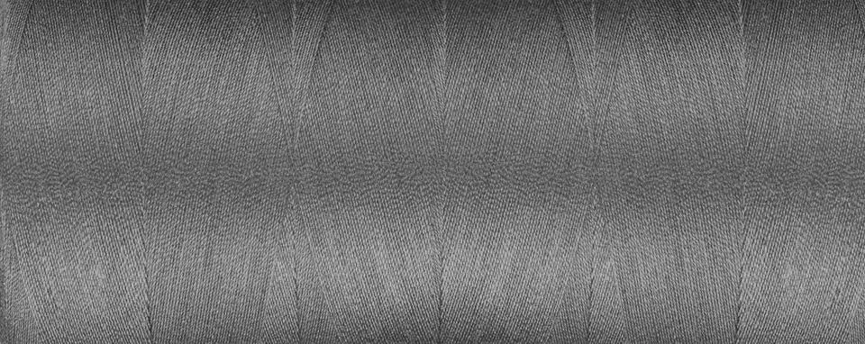 Texture of thread for a sewing machine gray colors on a white background Stock Photos