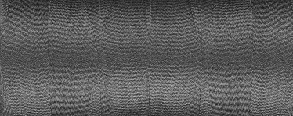 Texture of thread for a sewing machine gray colors on a white background 写真素材