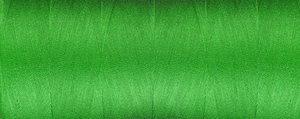 Texture of thread for a sewing machine green color on a white background Stock Photos