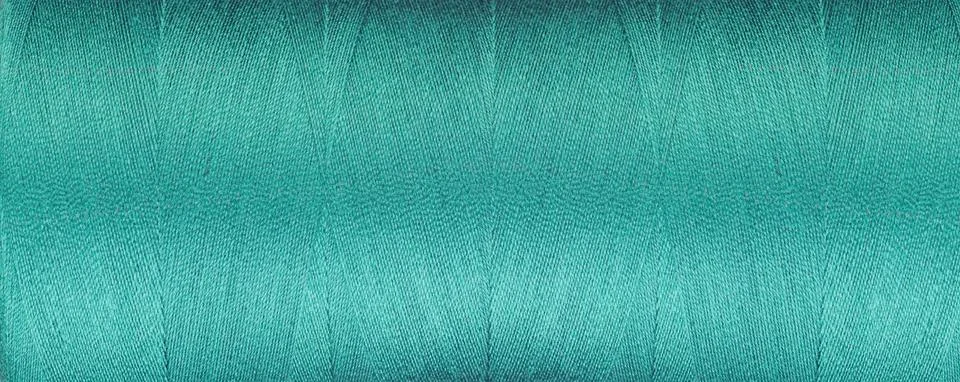 Texture of threads for a sewing machine blue colors on a white background Stock Photos