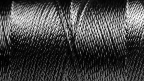 Texture of threads in a spool of black color. Stock Footage 248513690