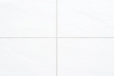 The texture of the tile is white. Stock Photos
