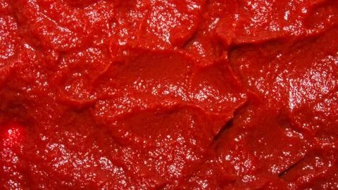 The texture of tomato paste.Ketchup background. Stock Photos