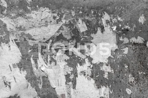 Texture of torn advertisement on an old rusty billboard panel Stock Photos