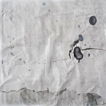 Texture of torn old paper stained with black printer ink Stock Photos