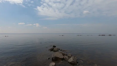 Texture of tranquil waves of river at autumn time against the background of ston Video stock 106549971