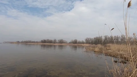 Texture of tranquil waves of river at autumn time against the background of ston Video stock 106549978