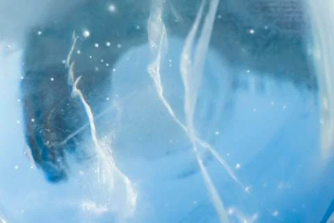 Texture of transparent ice with cracks. Stock Photos