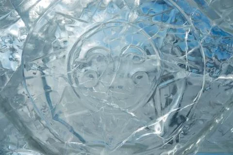 Texture of transparent ice with a pattern and cracks. Stock Photos