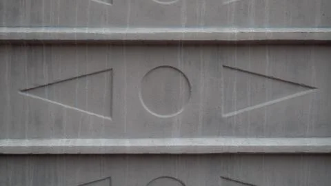 Texture of triangles and circle on a concrete slab Foto stock
