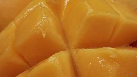 Texture of tropical fresh mango close-up macro, a food staple, are placed on a Video stock 275095741